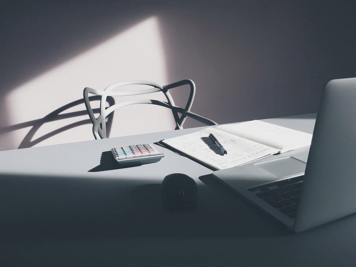 Laptop desk setup used to review ChatGPT traffic in GA4 reports and UTM tracking