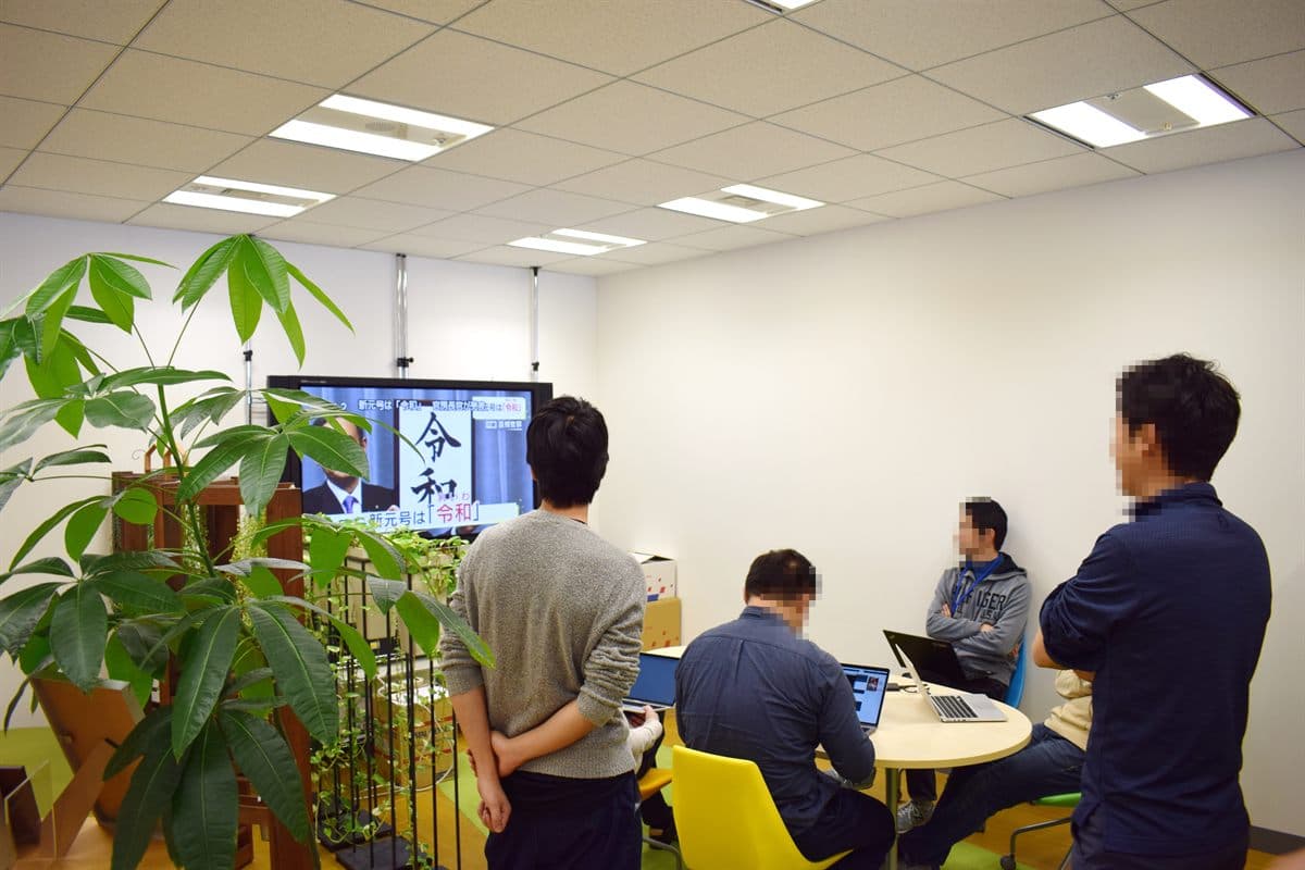 Office team reviewing ChatGPT traffic in GA4 dashboard changes and attribution notes