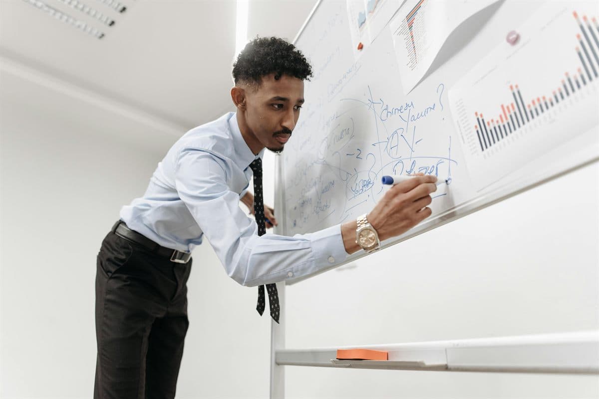Presenter auditing whiteboard notes for a claude searchbot robots.txt rollout and crawler QA checklist
