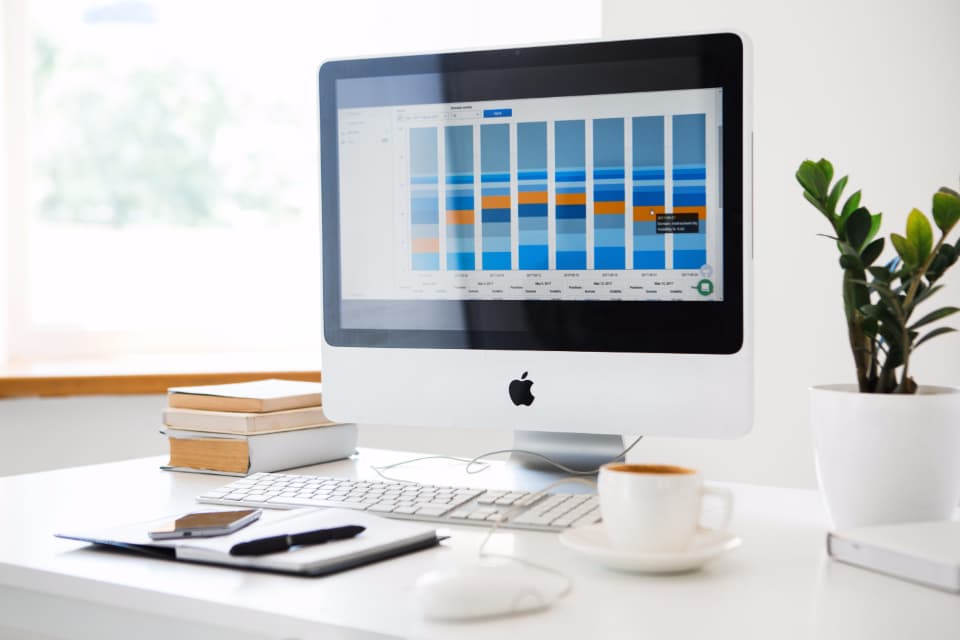 SEO analyst monitoring dashboards and search performance signals to improve AI answer visibility for fast-changing political queries